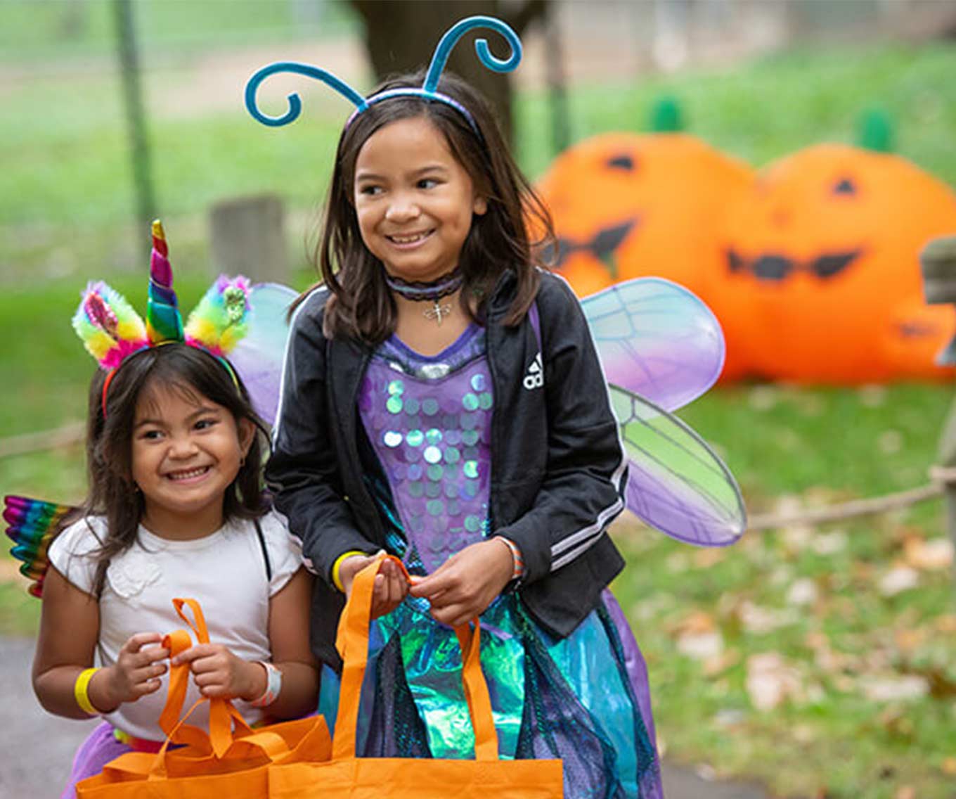 Two children in Halloween costumes.