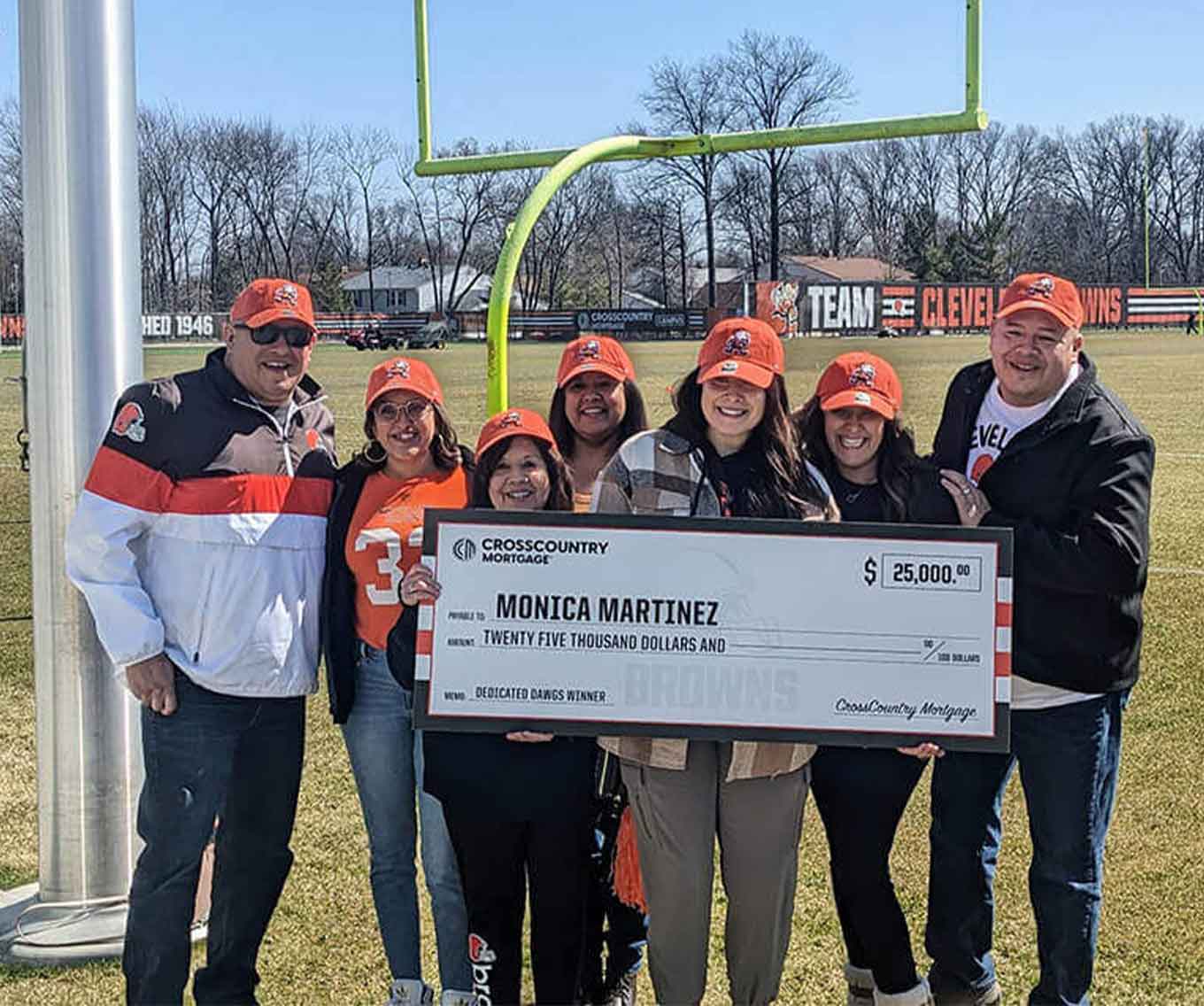 Monica Martinez of Maumee, OH receiving the grand prize from CrossCountry Mortgage