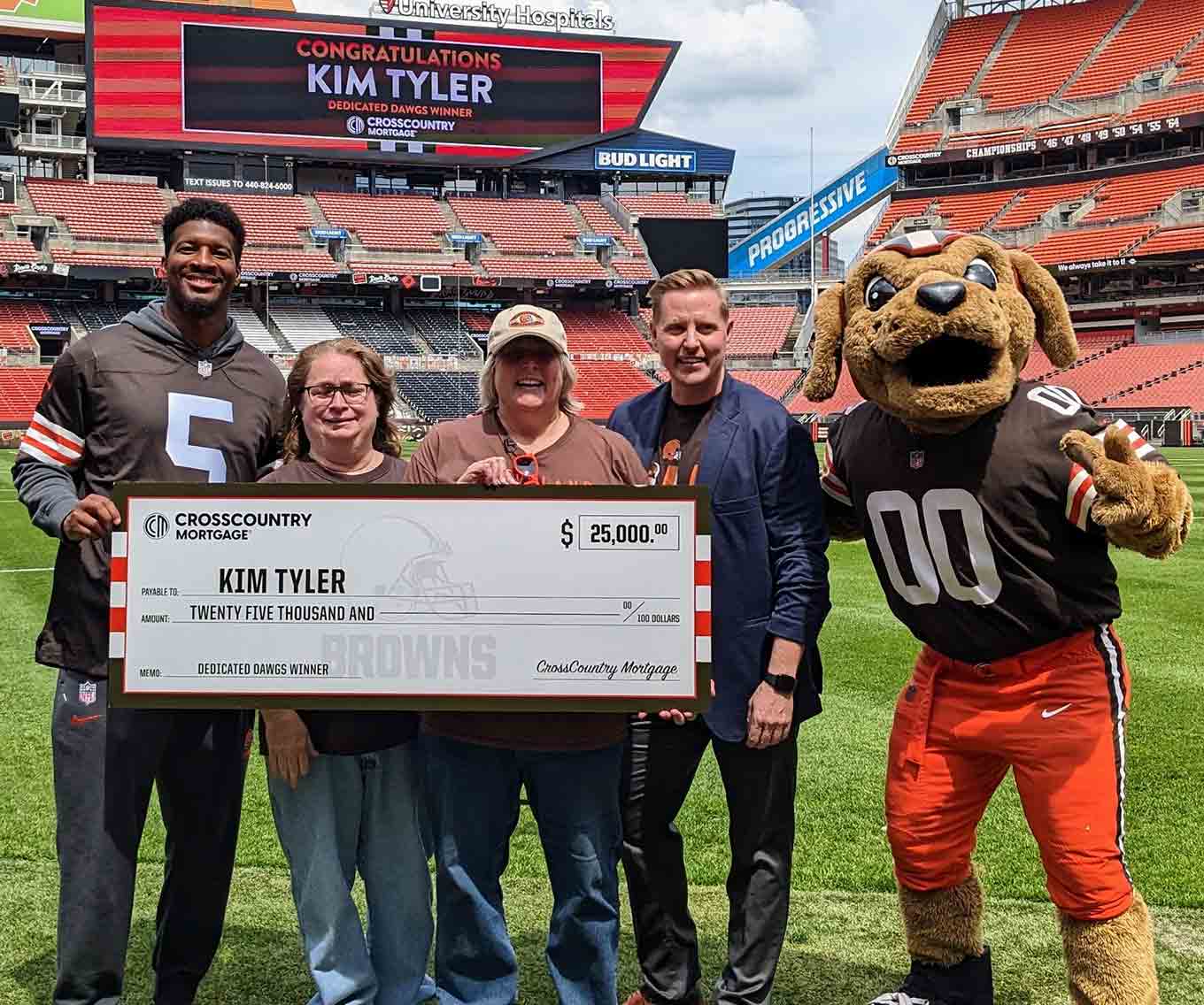 Kim Tyler of Parma, Ohio is the winner of the $25,000 grand prize in the CrossCountry Mortgage Dedicated Dawgs Sweepstakes.