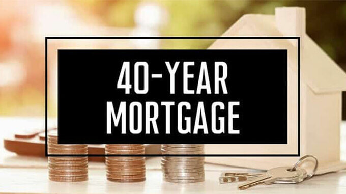 40 year mortgage graphic with house keys and coins on a table in the background.