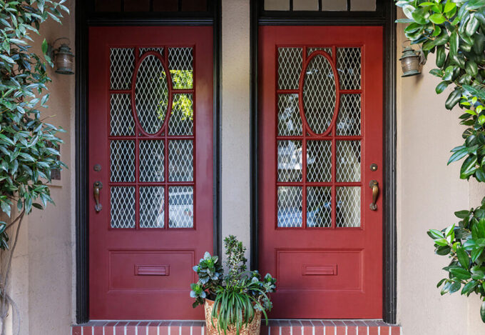 Front door of duplex home purchased for house hacking.