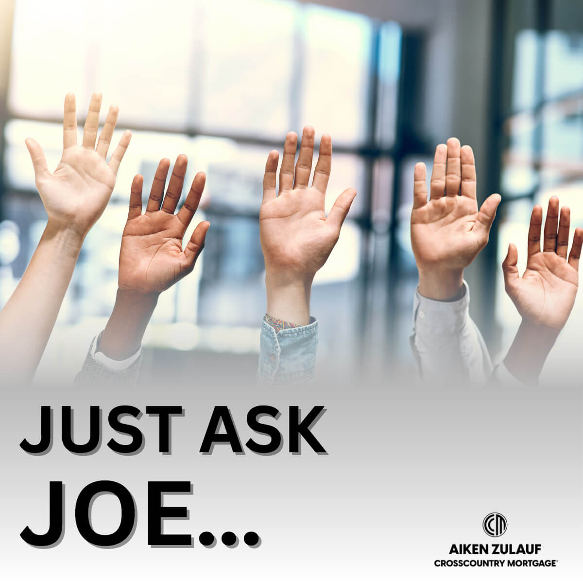 a crowd of hands raised. 