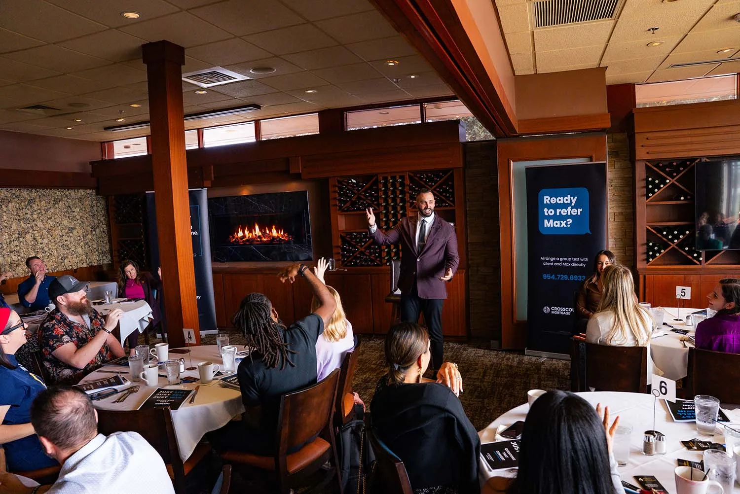 Max Fisch speaking at one of his events