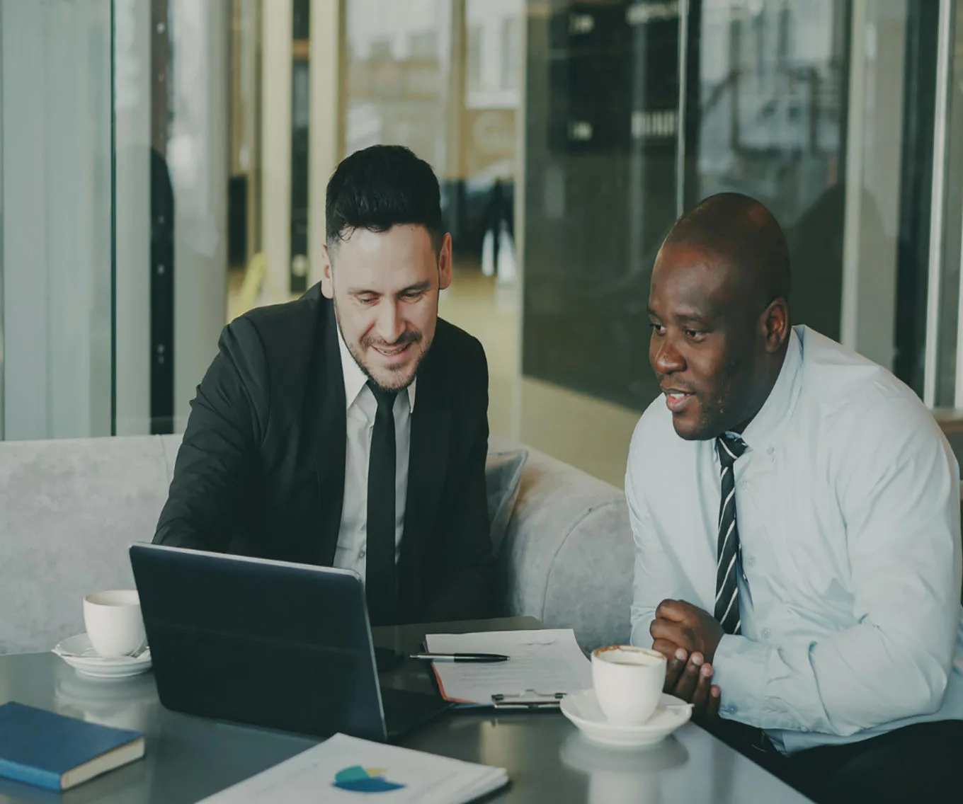 A loan officer and a realtor discussing the mortgage process.