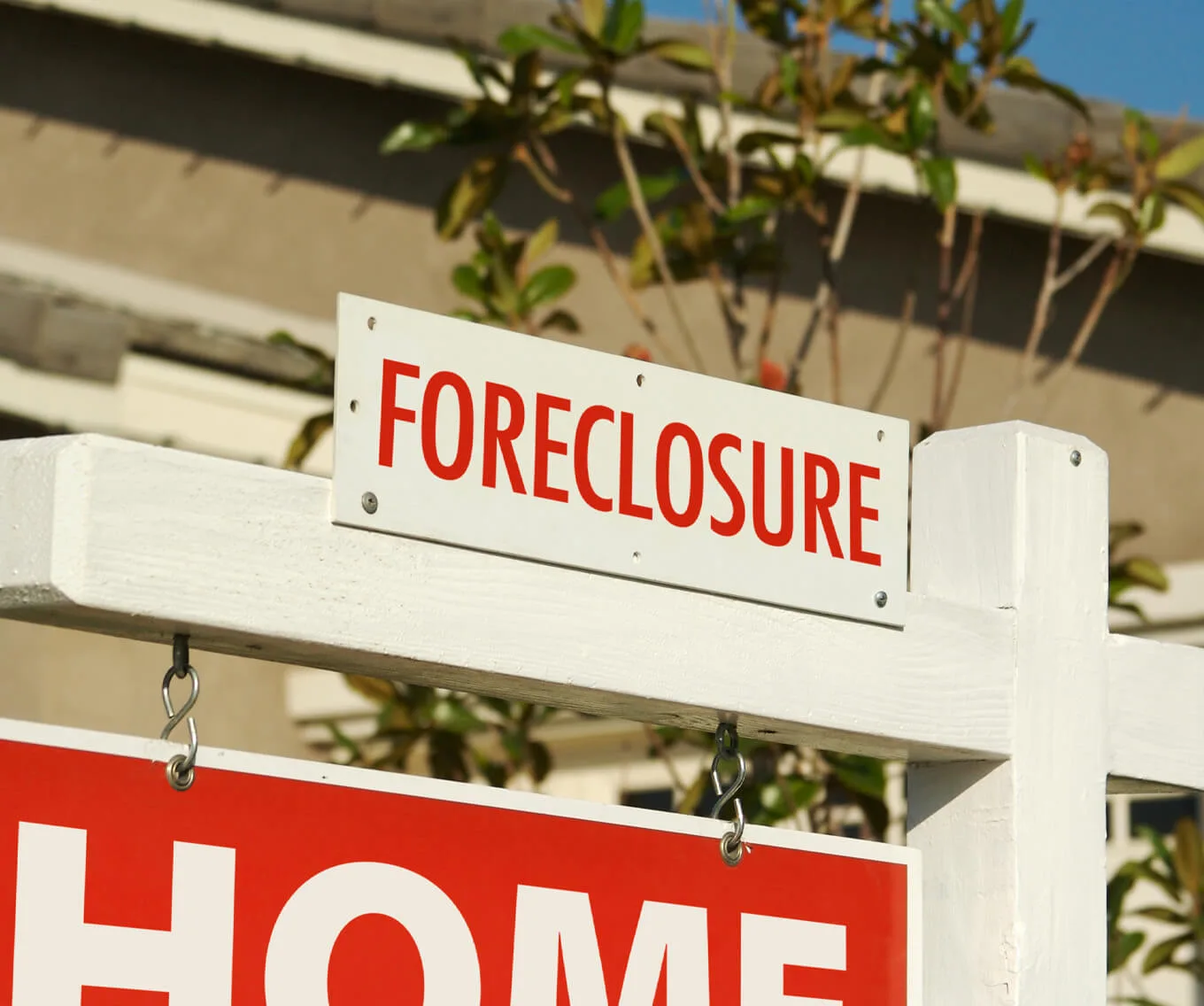 Foreclosure sign posted in front of a home.