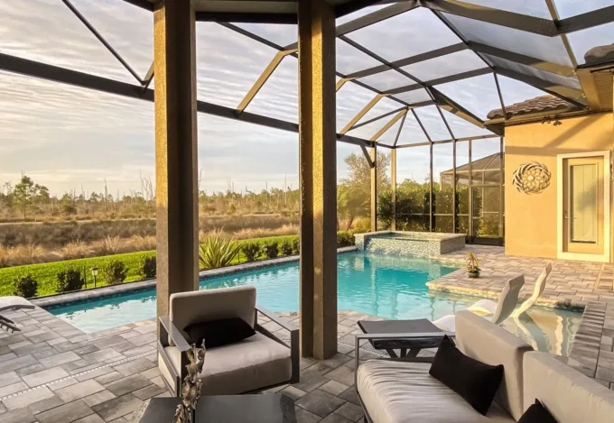 Covered patio and pool area at a short-term rental property.