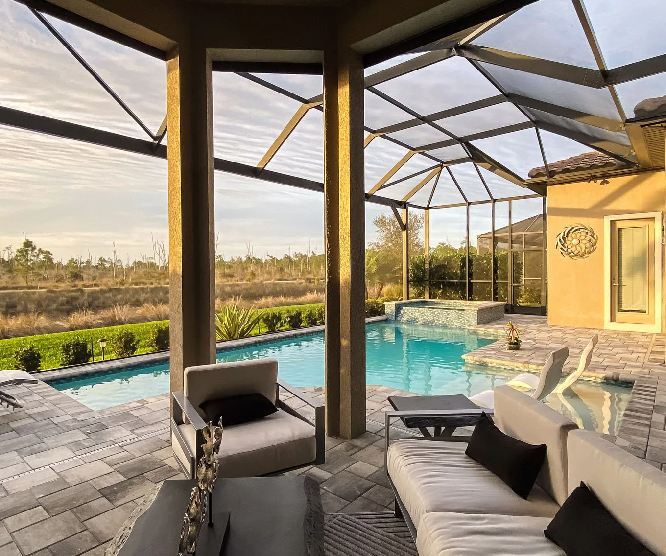 Covered patio and pool area at a short-term rental property.
