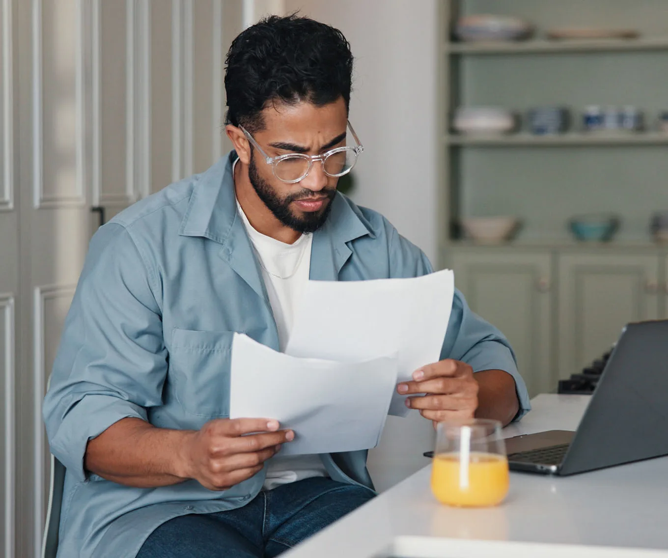 Homeowner reviewing financial documents to understand a lien on a house.